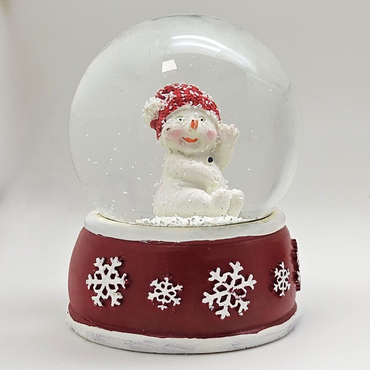Süße Schneekugel Schneemann dreht sich auf Sockel rot weiße Schneeflocke B: 65mm - Schneekugelhaus